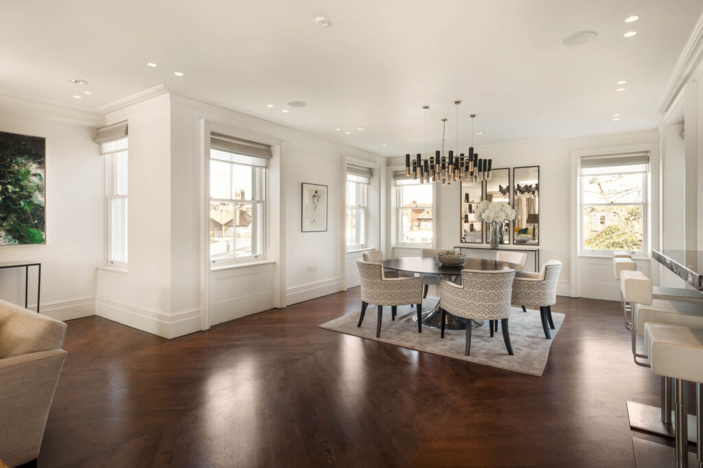 Dining room area within large lateral apartment in Notting Hill